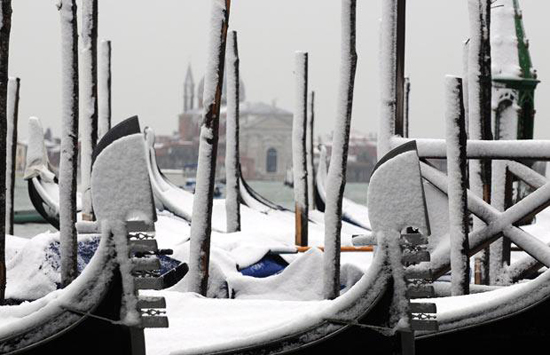 Snow-capped gondolas. Photo credit: EPA